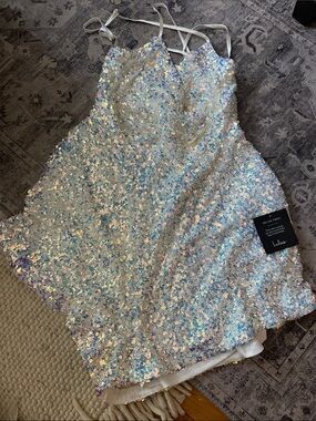 Iridescent Sequin romper Spaghetti Straps by lulus runs small more like a large